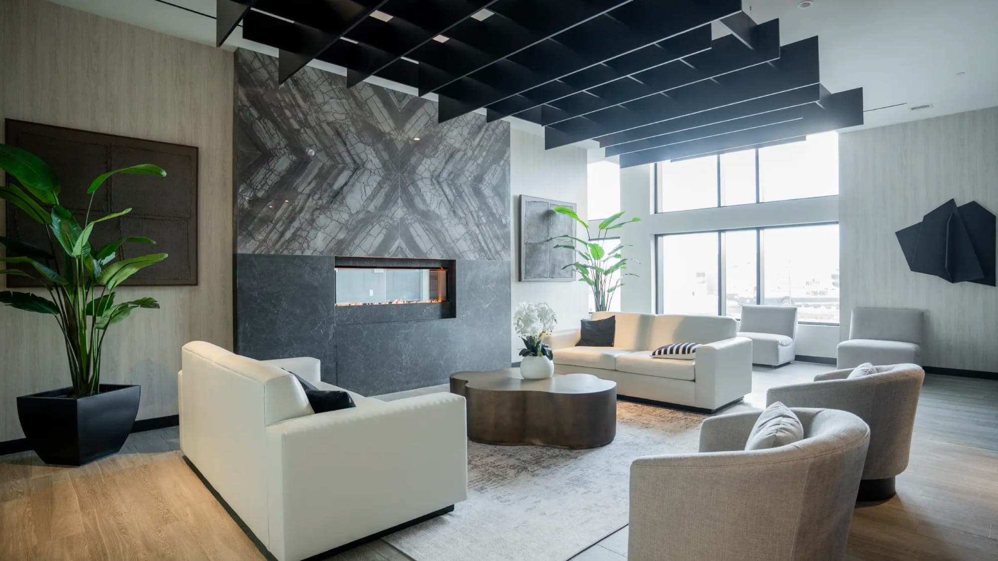 Party room with a fireplace wall and lounge seating.